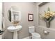 Charming half-bathroom featuring a pedestal sink and decorative accents at 6690 S Fenton St, Littleton, CO 80123