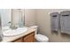 Clean bathroom with vanity, sink, and shower featuring a glass door, complete with fresh towels at 6690 S Fenton St, Littleton, CO 80123