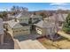 Beautiful home with a neutral exterior, multiple garage bays, and mature trees surrounding the property at 6690 S Fenton St, Littleton, CO 80123
