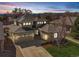 Charming home featuring a well-manicured lawn and a spacious driveway leading to a multi-car garage at 6690 S Fenton St, Littleton, CO 80123