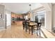 Bright eat-in kitchen features an island, stainless steel appliances, and a sliding door leading to the exterior at 6690 S Fenton St, Littleton, CO 80123