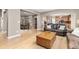 Open-concept living space featuring hardwood floors and views of the dining room, kitchen, and living room areas at 6690 S Fenton St, Littleton, CO 80123