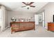 Bright and airy main bedroom with ceiling fan and plush carpeting at 6690 S Fenton St, Littleton, CO 80123