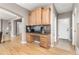 Office nook with built-in desk and overhead cabinets, conveniently located near the entryway at 6690 S Fenton St, Littleton, CO 80123