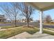 View of the front yard from the porch, showing the street and neighborhood at 5570 Nepal St, Denver, CO 80249