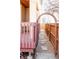Backyard features a wooden deck with a pathway framed by a wooden arch and fences at 433 N Ogden St, Denver, CO 80218