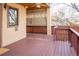 Spacious wooden deck provides an outdoor space for relaxing or entertaining, with overhead covering at 433 N Ogden St, Denver, CO 80218