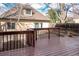 Back of the house with a cozy wooden deck, accessible via wooden stairs, overlooking the yard at 433 N Ogden St, Denver, CO 80218
