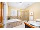 Bright bathroom featuring a separate shower, garden tub, and a neutral color palette at 433 N Ogden St, Denver, CO 80218