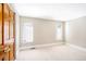 Neutral bedroom features natural lighting from the large windows, creating a calm atmosphere at 433 N Ogden St, Denver, CO 80218