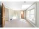 Bedroom featuring neutral colored walls, plush carpet, and a bay window at 433 N Ogden St, Denver, CO 80218