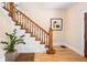 Well-lit foyer featuring hardwood floors, a classic staircase, and decorative accents at 433 N Ogden St, Denver, CO 80218