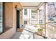 Spacious front porch featuring classic columns, decorative flowerpots, and a welcoming entrance at 433 N Ogden St, Denver, CO 80218