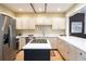 Bright kitchen with stainless steel appliances, ample counter space, and an island at 433 N Ogden St, Denver, CO 80218