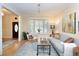 Bright living room with large windows, comfortable seating, and hardwood floors at 433 N Ogden St, Denver, CO 80218
