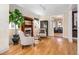Cozy living room featuring a fireplace, hardwood floors, comfortable seating, and elegant details at 433 N Ogden St, Denver, CO 80218