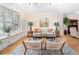 Bright living room with hardwood floors, large windows, comfortable seating, and stylish decor at 433 N Ogden St, Denver, CO 80218