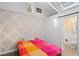 Cozy bedroom with patterned wall and bright window at 704 E Baseline Rd, Lafayette, CO 80026