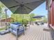 Inviting back deck with lounge seating and umbrellas, perfect for outdoor relaxation and entertaining at 845 Urban St, Lakewood, CO 80401