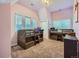 Bright bedroom featuring two bunk beds, neutral carpet, and natural light from three windows at 845 Urban St, Lakewood, CO 80401