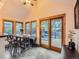 Cozy dining area with plenty of natural light and sliding glass doors leading to outdoor deck at 845 Urban St, Lakewood, CO 80401