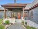 Charming covered front porch with stone accents and lovely landscaping at 845 Urban St, Lakewood, CO 80401