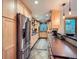 Well-lit kitchen featuring stainless steel appliances and sleek countertops at 845 Urban St, Lakewood, CO 80401