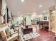 Spacious living room with wood floors, large windows, and a seamless flow to the kitchen at 845 Urban St, Lakewood, CO 80401