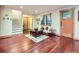 Cozy living room featuring hardwood floors, a stylish rug, and ample natural light at 845 Urban St, Lakewood, CO 80401