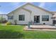 Landscaped backyard with concrete patio and small table with seating for outdoor enjoyment at 12513 Alcott St, Broomfield, CO 80020