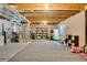 Spacious carpeted basement ready to be finished with exposed ductwork and lighting at 12513 Alcott St, Broomfield, CO 80020