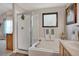 Bathroom with soaking tub, glass shower, and neutral tiling and decor for a modern, clean aesthetic at 12513 Alcott St, Broomfield, CO 80020