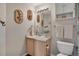 Cozy half bath features neutral paint, wood decorations and good natural light at 12513 Alcott St, Broomfield, CO 80020