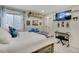 Comfortable bedroom with closet, shelving, large window, and entertainment area at 12513 Alcott St, Broomfield, CO 80020