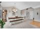 Open dining area with a large wooden table, chairs, and a bench, perfect for gatherings at 12513 Alcott St, Broomfield, CO 80020