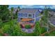 A backyard featuring an entertainment deck with pergola, a well manicured lawn, and privacy landscaping at 14620 Prairie Sky Ln, Broomfield, CO 80023