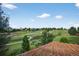 Enjoy serene backyard views with a walking path in this community, seen from a home's lattice-covered patio at 14620 Prairie Sky Ln, Broomfield, CO 80023