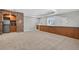 Finished basement with a kitchenette, built-in storage, and a window offering ample natural light at 14620 Prairie Sky Ln, Broomfield, CO 80023