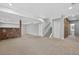 Spacious finished basement features stone accents, recessed lighting, and stairs to the upper level at 14620 Prairie Sky Ln, Broomfield, CO 80023