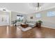 Bright living room with hardwood floors, large windows, and comfortable seating at 14620 Prairie Sky Ln, Broomfield, CO 80023
