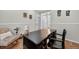 Well-lit home office with hardwood floors, a dark desk, and a comfortable chair at 14620 Prairie Sky Ln, Broomfield, CO 80023