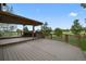 Spacious patio with an overhead structure and built-in grill, perfect for outdoor relaxation at 14620 Prairie Sky Ln, Broomfield, CO 80023