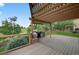 Covered outdoor patio with seating area and built-in grill; ideal for entertaining at 14620 Prairie Sky Ln, Broomfield, CO 80023