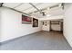 Spacious garage with an epoxy floor, shelving, and storage, ready for your projects at 8751 Pearl St # J3, Thornton, CO 80229