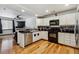Bright kitchen boasts modern appliances, granite counters and hardwood floors at 8751 Pearl St # J3, Thornton, CO 80229
