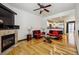 Contemporary living room with a fireplace, hardwood floors, and modern furniture, creating a stylish and comfortable space at 8751 Pearl St # J3, Thornton, CO 80229