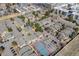 An aerial view of townhomes showcasing community amenities like the pool and tennis court at 4400 S Quebec St # 107, Denver, CO 80237