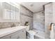 Tastefully updated bathroom featuring modern tile work, vanity, and walk-in shower at 4400 S Quebec St # 107, Denver, CO 80237