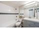 Renovated bathroom featuring modern vanity, tiled shower, and contemporary fixtures at 4400 S Quebec St # 107, Denver, CO 80237