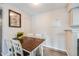 Cozy dining area featuring a wooden table and chairs with a view of the kitchen at 4400 S Quebec St # 107, Denver, CO 80237